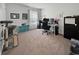 Bright home office with neutral walls, comfortable carpeting, and a window with bright natural light at 2230 Ainsley Dr., Little River, SC 29566