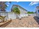 Charming backyard with white picket fence and brick patio, perfect for outdoor entertaining at 2405 Duffy St., North Myrtle Beach, SC 29582
