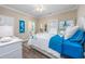 Cozy bedroom featuring coastal decor, mermaid wall art, and wood-look floors at 2405 Duffy St., North Myrtle Beach, SC 29582