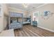 A bedroom featuring a bunk bed, coastal decorations, and wood-look floors at 2405 Duffy St., North Myrtle Beach, SC 29582
