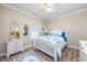 Comfortable bedroom featuring coastal decor, mermaid wall art, and wood-look floors at 2405 Duffy St., North Myrtle Beach, SC 29582