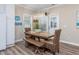 Bright dining area featuring modern lighting, a wooden table, and comfortable seating at 2405 Duffy St., North Myrtle Beach, SC 29582