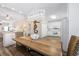 Dining area with unique chandelier, beachy decor, and open view to the kitchen at 2405 Duffy St., North Myrtle Beach, SC 29582