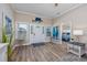 Inviting foyer with wood floors, marlin decor, and views into the adjacent bedroom at 2405 Duffy St., North Myrtle Beach, SC 29582