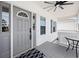Charming front porch features a gray door, black and white rug, and stylish accents at 2405 Duffy St., North Myrtle Beach, SC 29582
