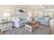 Cozy living room with coastal decor, comfortable sofas, and an open floor plan at 2405 Duffy St., North Myrtle Beach, SC 29582
