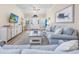 Bright living room with beach-themed decor, comfortable seating, and wood-look flooring at 2405 Duffy St., North Myrtle Beach, SC 29582