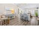 Open-concept living space with modern decor, bar seating, and access to dining and kitchen at 2405 Duffy St., North Myrtle Beach, SC 29582