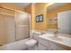 Well-lit bathroom with tub shower, toilet, and sink with vanity at 251 Egret Run Ln. # 1122, Pawleys Island, SC 29585