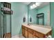 Modern bathroom with wood vanity, large mirror, and open shelf for towels at 251 Egret Run Ln. # 1122, Pawleys Island, SC 29585