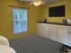 Bright bedroom features a ceiling fan, TV, and white cabinets for ample storage at 251 Egret Run Ln. # 1122, Pawleys Island, SC 29585