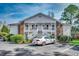 Inviting two-story condo featuring white siding and a charming exterior staircase and landscaping at 251 Egret Run Ln. # 1122, Pawleys Island, SC 29585