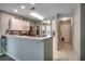 Open kitchen featuring stainless steel appliances, marble flooring, and bar top counter at 251 Egret Run Ln. # 1122, Pawleys Island, SC 29585