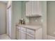 Kitchen pantry area featuring custom cabinetry and granite countertops, adjacent to pantry at 251 Egret Run Ln. # 1122, Pawleys Island, SC 29585