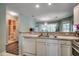 Open kitchen featuring sleek appliances and double basin sink overlooking the living room at 251 Egret Run Ln. # 1122, Pawleys Island, SC 29585