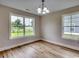 Dining room featuring wood floors and natural light at 2599 Woodcreek Ln., Conway, SC 29527