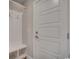 Entrance with coat rack featuring storage bench, hooks, and paneled door at 2599 Woodcreek Ln., Conway, SC 29527