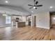 Open-concept living space featuring hardwood floors and a modern kitchen at 2599 Woodcreek Ln., Conway, SC 29527