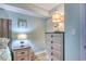 A cozy bedroom featuring lamps, coastal-themed art, and ample storage space at 2801 S Ocean Blvd. # 538, North Myrtle Beach, SC 29582
