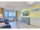 Cozy living room with ocean view balcony, TV, and side table and ocean-themed decor at 2801 S Ocean Blvd. # 538, North Myrtle Beach, SC 29582