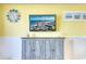 Stylish living room featuring ocean-themed decor, TV, and a rustic blue console table for storage at 2801 S Ocean Blvd. # 538, North Myrtle Beach, SC 29582
