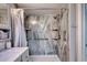 The shower is equipped with an adjustable shower head, grab bar, and shelves at 2801 S Ocean Blvd. # 538, North Myrtle Beach, SC 29582