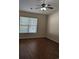 Cozy bedroom with wood-look flooring, a ceiling fan, and a bright window at 281 Palmetto Glen Dr., Myrtle Beach, SC 29588