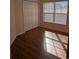 Bedroom features wood flooring, a double window for natural light, and a closet at 281 Palmetto Glen Dr., Myrtle Beach, SC 29588