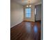 Bright dining area featuring wood-look flooring and a modern chandelier at 281 Palmetto Glen Dr., Myrtle Beach, SC 29588