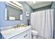 Well-lit bathroom featuring a marble vanity with a mirror and a shower/tub combination at 3105 Robyn Ct., Little River, SC 29566