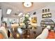 Stylish dining area adjacent to the living room and bathed in light from the skylights at 3105 Robyn Ct., Little River, SC 29566