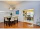 Elegant dining area showcasing stylish decor, lighting, and a view into the connected kitchen at 3105 Robyn Ct., Little River, SC 29566