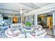 Bright sunroom with comfortable seating, natural light, and access to the outdoors at 3105 Robyn Ct., Little River, SC 29566