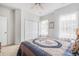 Bedroom featuring carpet flooring, ceiling fan, window and closet with folding doors at 364 Palm Lakes Blvd., Little River, SC 29566