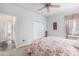 Bedroom features patterned bedding, carpet flooring, window, and closet at 364 Palm Lakes Blvd., Little River, SC 29566