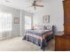 Bedroom featuring carpet flooring, ceiling fan, and natural light from a window at 364 Palm Lakes Blvd., Little River, SC 29566