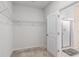 Walk-in closet with wire shelving system and carpet flooring, adjacent to shower at 364 Palm Lakes Blvd., Little River, SC 29566