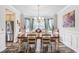 Dining room featuring a decorative chandelier, large dining table, and chair set at 364 Palm Lakes Blvd., Little River, SC 29566