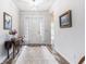 Bright and inviting foyer featuring elegant tile flooring and a view of the front door at 364 Palm Lakes Blvd., Little River, SC 29566