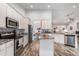 Spacious kitchen with white cabinets, granite countertops, and stainless steel appliances at 364 Palm Lakes Blvd., Little River, SC 29566