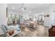 Spacious living room with high ceilings, a fireplace, and seamless flow to the dining area at 364 Palm Lakes Blvd., Little River, SC 29566