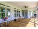 Comfortable covered back porch with ceiling fans and outdoor seating, ideal for entertaining and relaxation at 3718 Highway 931, Conway, SC 29526