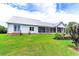 Spacious backyard with a well-maintained lawn and exterior view of the house at 3718 Highway 931, Conway, SC 29526