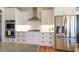Bright kitchen featuring stainless steel appliances, white cabinetry, and subway tile backsplash at 3718 Highway 931, Conway, SC 29526