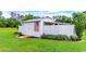 Well-maintained outbuilding with an American flag displayed and landscaped surroundings at 3718 Highway 931, Conway, SC 29526