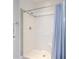 Bright shower featuring a shower curtain, chrome fixtures, and a tiled surround at 3718 Highway 931, Conway, SC 29526