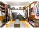 Organized walk-in closet with custom shelving, drawers, and a patterned rug at 3718 Highway 931, Conway, SC 29526