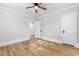 Bedroom features light wood floors, neutral walls and doors on opposite sides of room at 401 S Nichols St., Nichols, SC 29581