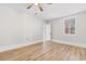 Bright bedroom featuring hardwood floors, a window, and fresh paint at 401 S Nichols St., Nichols, SC 29581