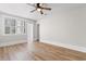 Bright, airy bedroom features wood-look floors and a large window at 401 S Nichols St., Nichols, SC 29581